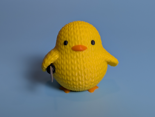 Knitted duck with a knife action figure